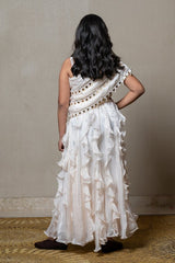 Elegant ivory one - shoulder gown with cascading ruffles and sequin embellishments, perfect for making a chic statement at any special occasion - Kirti Agarwal