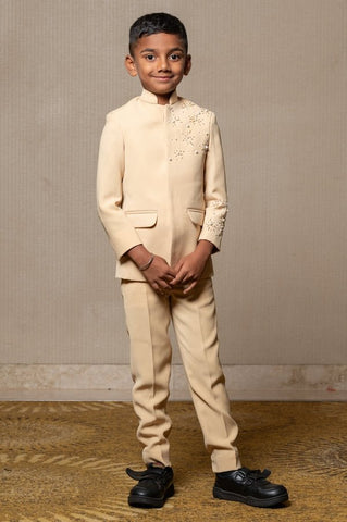 Elegant light beige bandhgala suit with delicate floral embroidery, paired with matching slim-fit trousers for a refined and sophisticated look