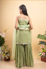 Elegant light Green sleeveless kurti with sequin details, paired with matching sharara pants and a sheer dupatta - Kirti Agarwal