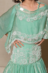 Elegant mint Green top and Lahenga with intricate white embroidery and a flowing silhouette, perfect for making a stylish statement at any festive occasion. - Kirti Agarwal