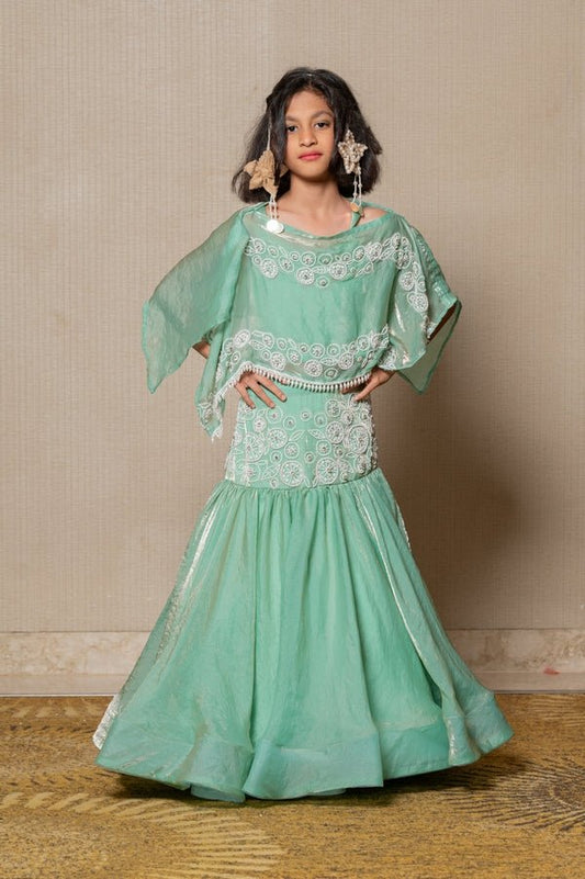 Elegant mint Green top and Lahenga with intricate white embroidery and a flowing silhouette, perfect for making a stylish statement at any festive occasion. - Kirti Agarwal