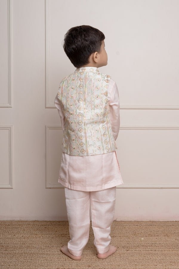 Elegant pastel pink kurta set with an intricately embroidered ivory jacket, perfect for festive occasions - Kirti Agarwal