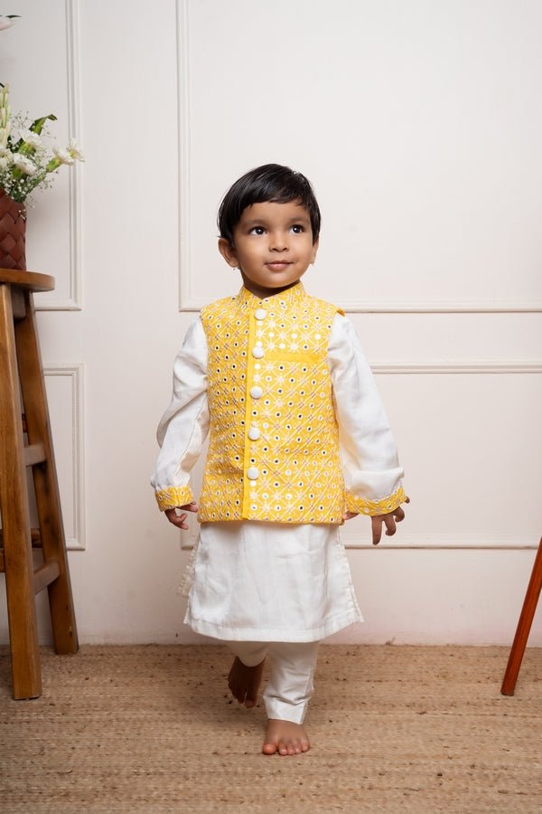 Elegant white kurta set with a vibrant yellow mirror - work Nehru jacket for a festive and stylish look - Kirti Agarwal