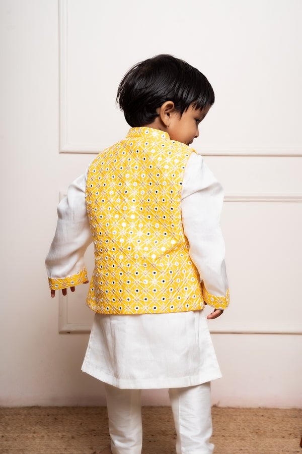 Elegant white kurta set with a vibrant yellow mirror - work Nehru jacket for a festive and stylish look - Kirti Agarwal