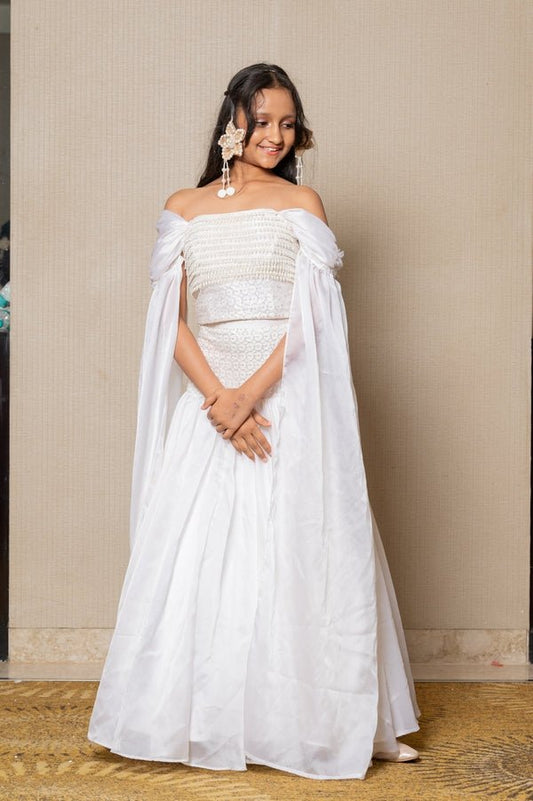Elegant white off - the - shoulder Lahenga with intricate beadwork and flowing sleeves, perfect for a timeless and graceful look at any formal event. - Kirti Agarwal