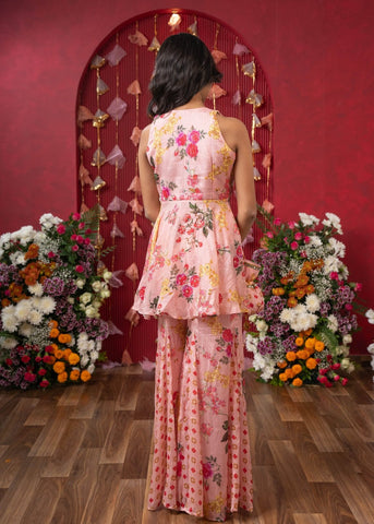 Floral Elegance: A chic peplum set with matching potli for festive charm - Kirti Agarwal