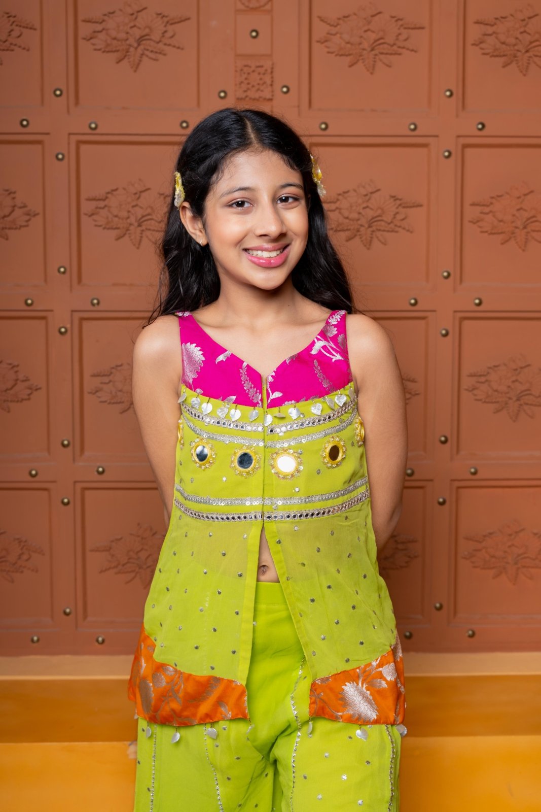 Girls festive sharara set in vibrant pink and lime green, crafted in soft Georgette with Brocade Silk accents, featuring mirror work, sequins, and elegant detailing – perfect ethnic wear for weddings, parties, and celebrations - Kirti Agarwal