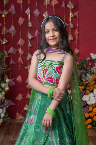 Grace your festivities with this vibrant green lehenga set, featuring floral embroidery and a flowy printed skirt - Kirti Agarwal