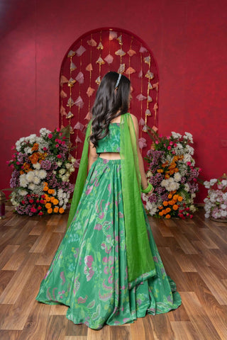 Grace your festivities with this vibrant green lehenga set, featuring floral embroidery and a flowy printed skirt - Kirti Agarwal