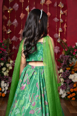 Grace your festivities with this vibrant green lehenga set, featuring floral embroidery and a flowy printed skirt - Kirti Agarwal