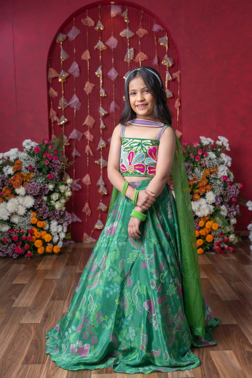 Grace your festivities with this vibrant green lehenga set, featuring floral embroidery and a flowy printed skirt - Kirti Agarwal