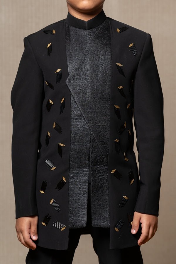 Modern Blacksuit with embroidered gold accents and a high Mandarin collar, perfect for a sleek and sophisticated look. - Kirti Agarwal