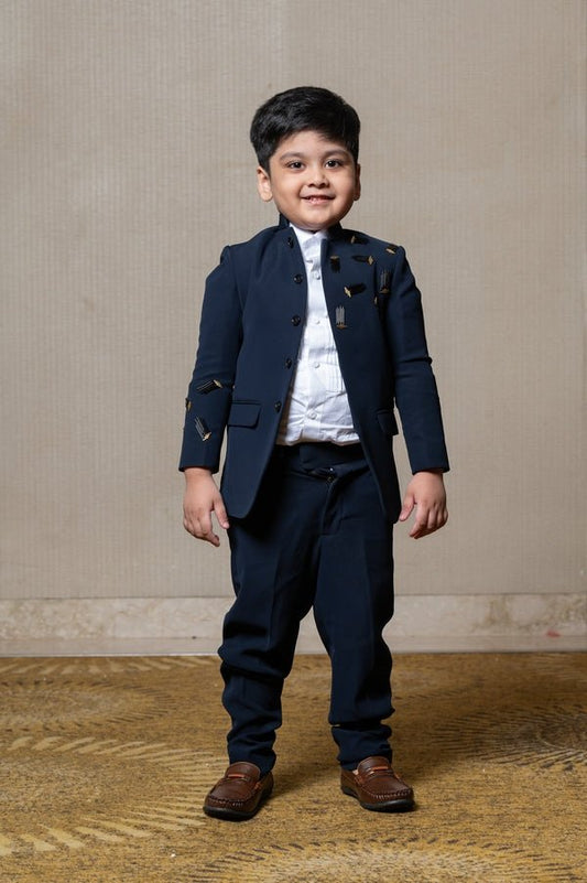 Navy blue blazer with elegant metallic embroidery, paired with matching trousers and a crisp white shirt for a refined formal look - Kirti Agarwal