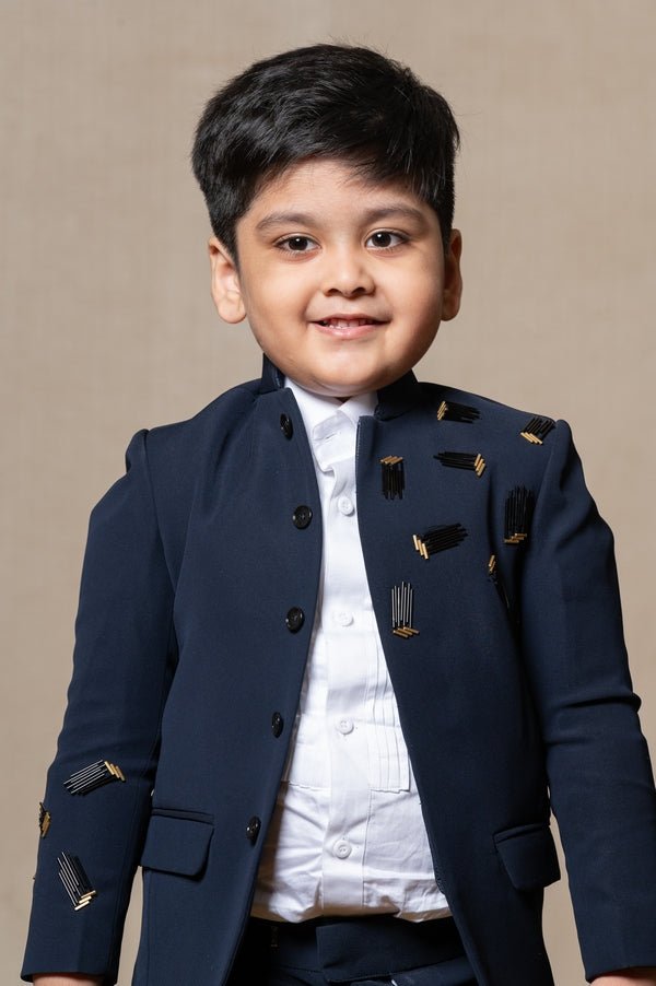 Navy blue blazer with elegant metallic embroidery, paired with matching trousers and a crisp white shirt for a refined formal look - Kirti Agarwal