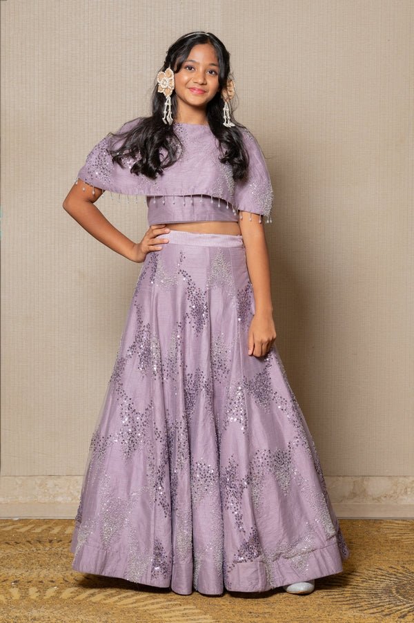 Stunning lilac ensemble with sequin embellishments and a flowing Lahenga, perfect for a graceful and elegant look at any special occasion. - Kirti Agarwal