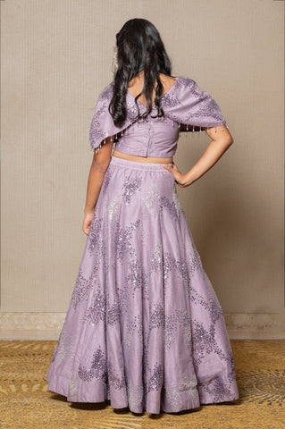 Stunning lilac ensemble with sequin embellishments and a flowing Lahenga, perfect for a graceful and elegant look at any special occasion. - Kirti Agarwal