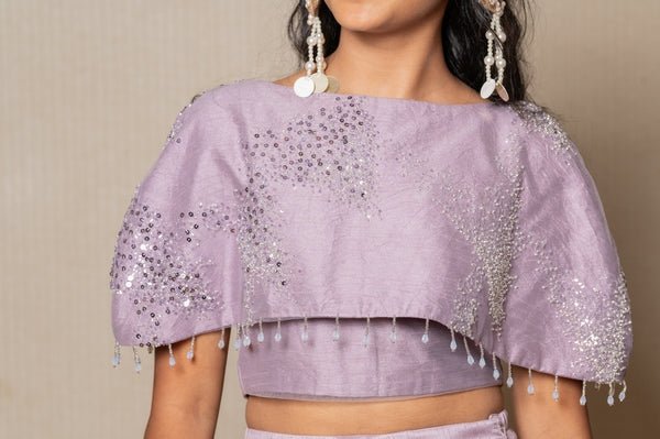 Stunning lilac ensemble with sequin embellishments and a flowing Lahenga, perfect for a graceful and elegant look at any special occasion. - Kirti Agarwal