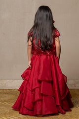 Stunning red gown with a tiered Lahenga and sequined bolero, perfect for making a bold statement at any special occasion. - Kirti Agarwal