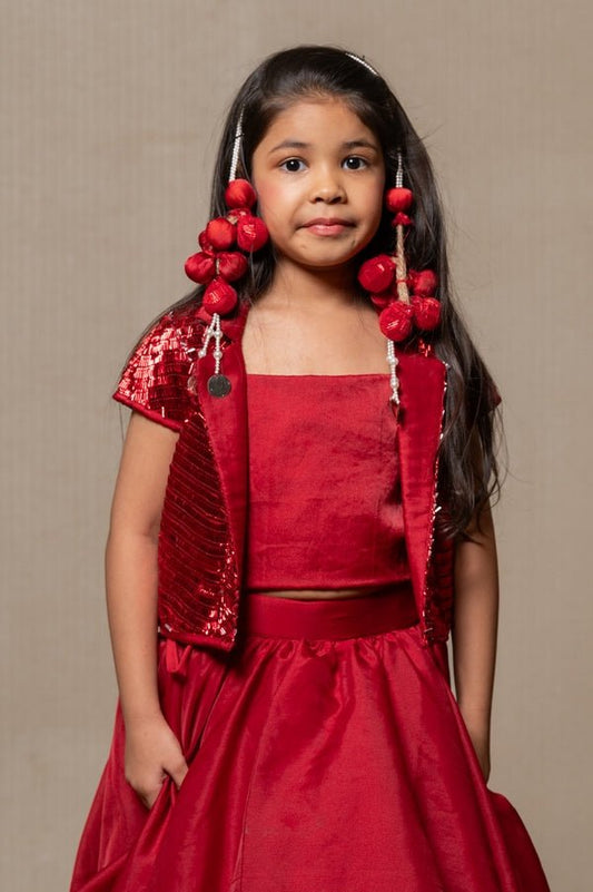 Stunning red gown with a tiered Lahenga and sequined bolero, perfect for making a bold statement at any special occasion. - Kirti Agarwal