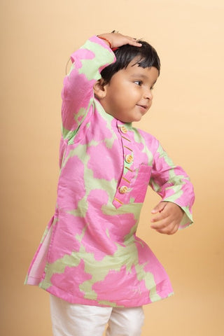 Vibrant pink and green tie - dye kurta paired with classic white pants for a playful yet elegant festive look - Kirti Agarwal