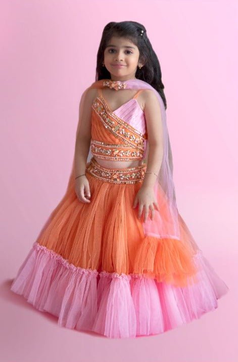 Orange And Baby Pink Dual Tone Pleated Top And Ruffle Lehenga With Knot Detail Dupatta - Kirti Agarwal